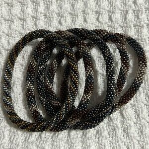 Sashka Co handcrafted glass bead bracelet lot. Dark metallics. Appr 8”. Roll on.